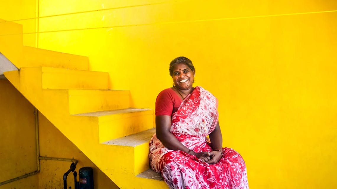 https://a.storyblok.com/f/223101/1140x641/888419e988/woman_on_stairs_in_yellow_room.jpg